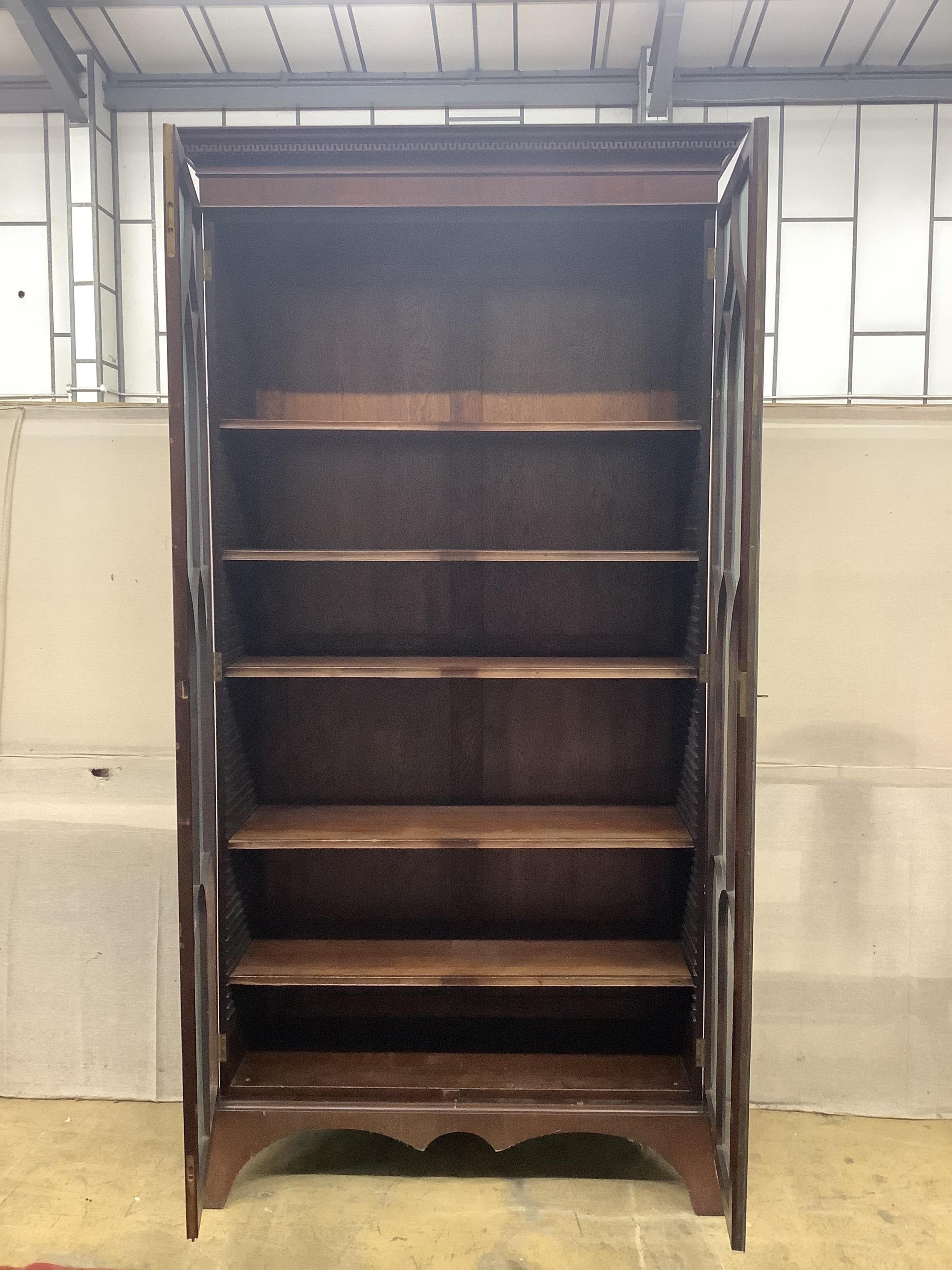 A George III style mahogany bookcase, width 116cm, depth 42cm, height 229cm. Condition - fair